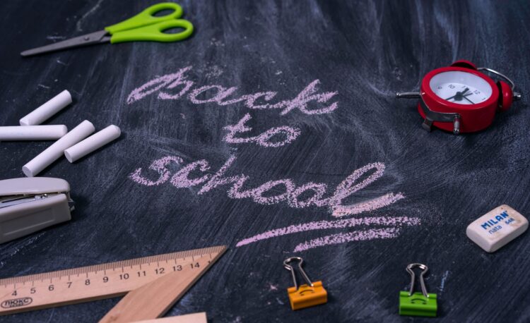 Back to school written in chalk on a blackboard